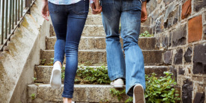 Hip young couple walking up steps